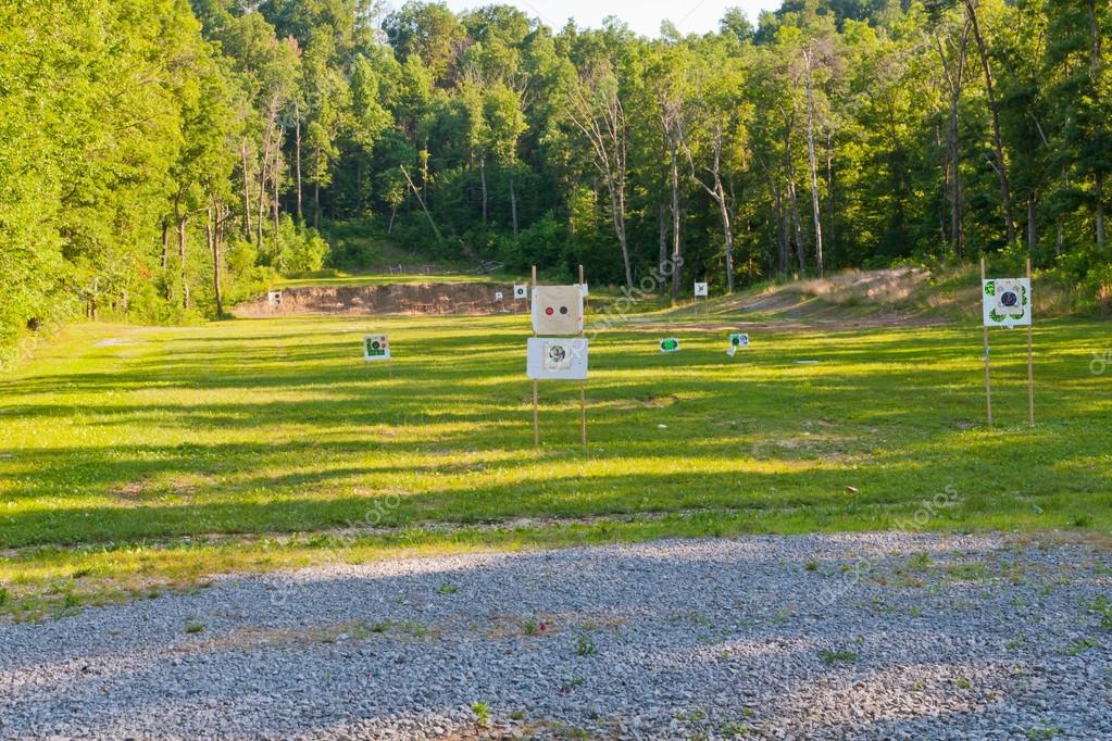 Outdoor shooting range with targets at different distances. — Stock