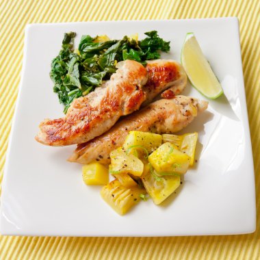 Roasted chicken breast with saute kale and squash vegetables