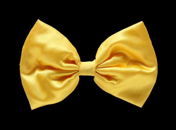 Gold satin gift bow. Ribbon. Isolated on black with clipping pat — Stock Photo, Image