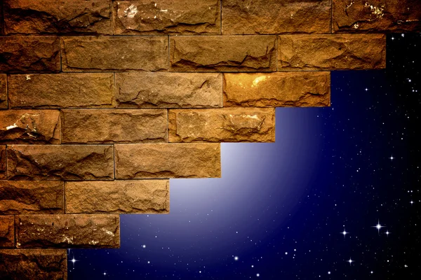 Night sky with light through the hole in the brick wall — Stock Photo, Image