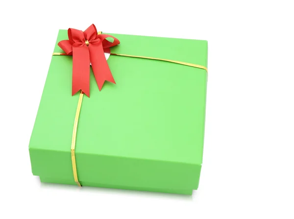 Green gift box with red ribbon bow isolated on white background — Stock Photo, Image