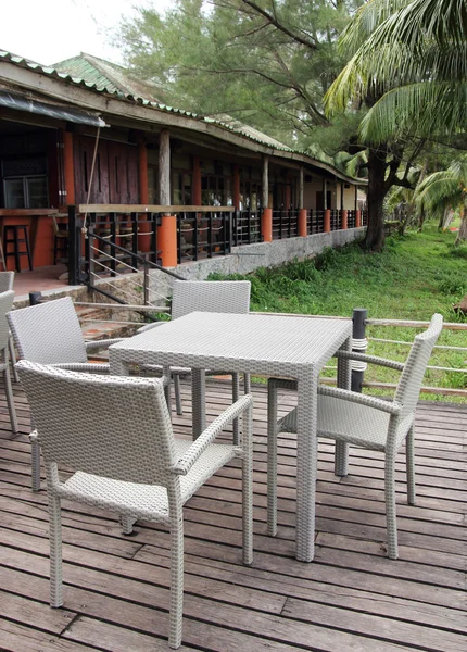 Outdoor restaurant with tables and chairs in resort — Stock Photo, Image