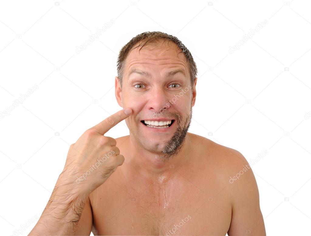 Smiling man half shaved on the white background
