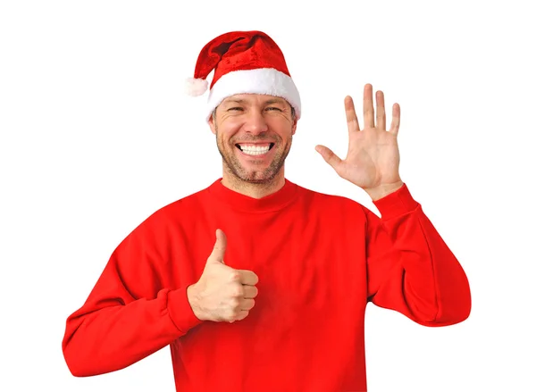 Sorrindo homem de Natal vestindo um chapéu de Papai Noel isolado no branco — Fotografia de Stock