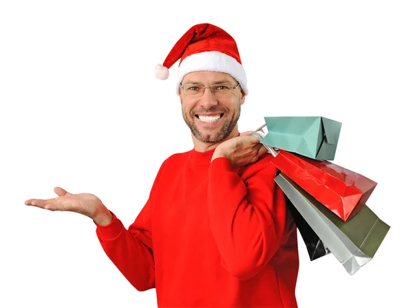 Sorridente uomo di Natale indossa un cappello di Babbo Natale isolato sul bianco — Foto Stock