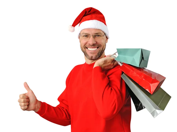 Sorridente uomo di Natale indossa un cappello di Babbo Natale isolato sul bianco — Foto Stock