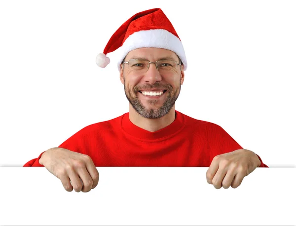 Sorridente uomo di Natale indossa un cappello di Babbo Natale isolato sul bianco — Foto Stock