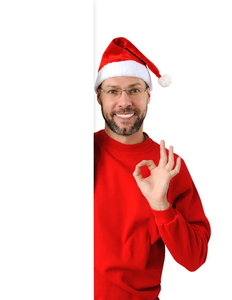 Smiling christmas man wearing a santa hat isolated on the white — Stock Photo, Image