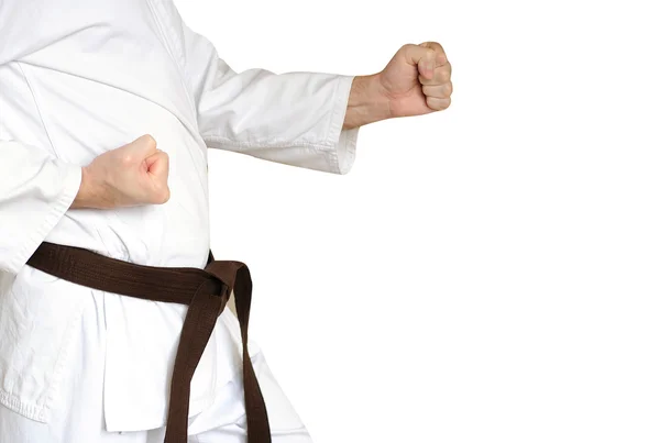 Muž v kimonu a pás pro bojová umění na bílé poza — Stock fotografie