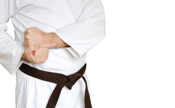 Hombre en un kimono y cinturón para artes marciales en el fondo blanco — Foto de Stock