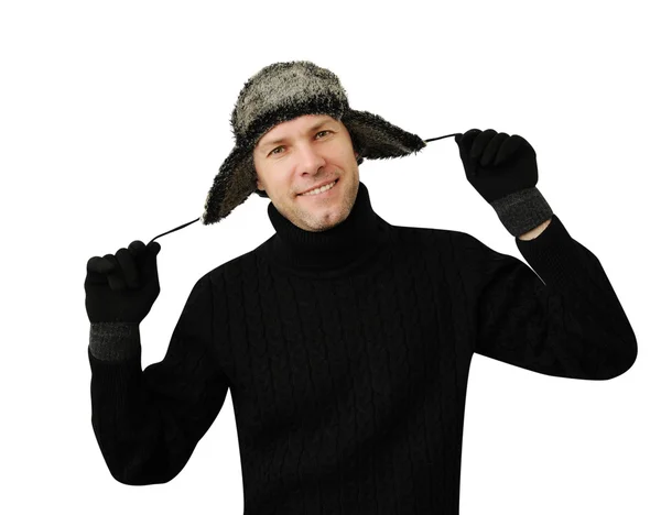 Smiling man in black dressed in warm clothes and cap — Stock Photo, Image