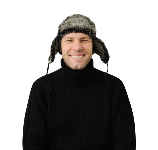 Hombre sonriente de negro vestido con ropa de abrigo y gorra — Foto de Stock