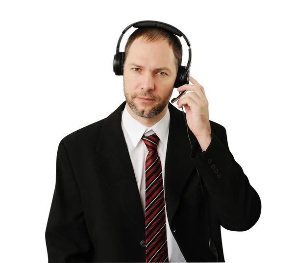 Hombre de traje con auriculares aislados en blanco — Foto de Stock