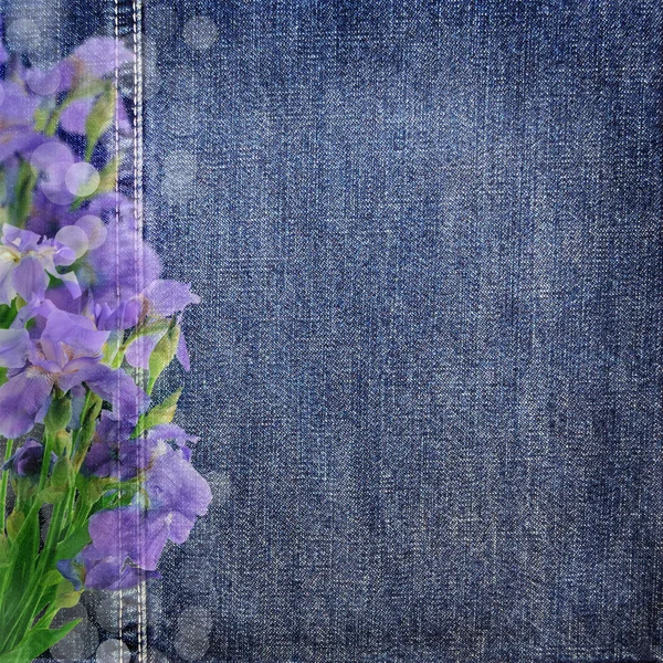 Background denim texture with purple flowers — Stock Photo, Image