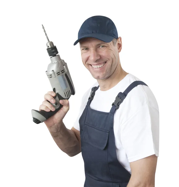 Portret van lachende werknemer in blauwe uniform met boren geïsoleerde o — Stockfoto