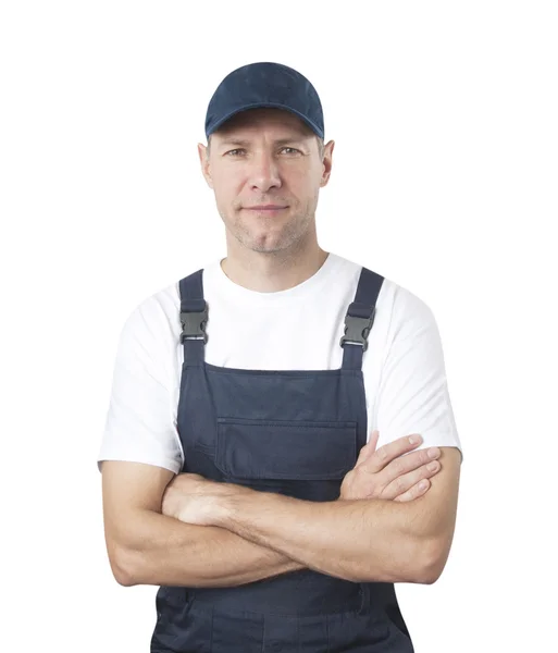 Portret van lachende werknemer in blauwe uniform geïsoleerd op witte bac — Stockfoto