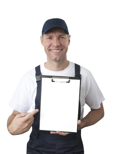 Портрет улыбающегося рабочего в синей форме с изолированной табличкой — стоковое фото