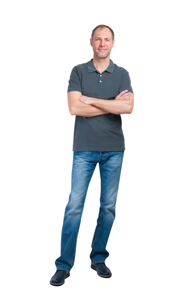 Hombre sonriente en camiseta gris y jeanse aislado sobre fondo blanco —  Fotos de Stock