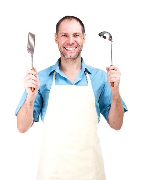 Glimlachende man koken in schort geïsoleerd op witte achtergrond — Stockfoto