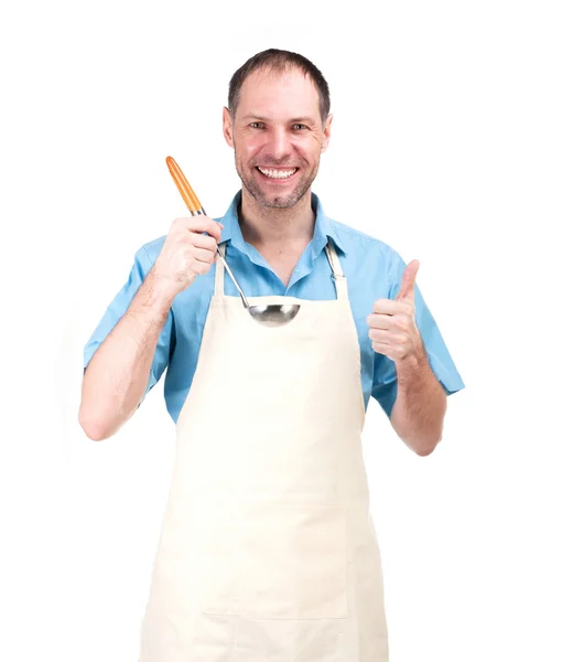 Smiling man cooking in apron isolated on white background Stock Photo