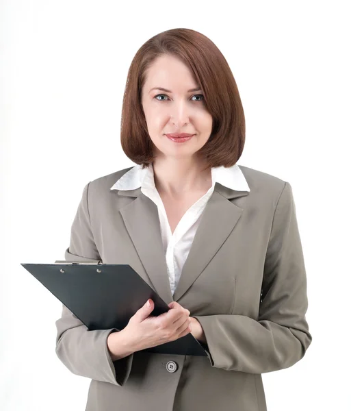 Hübsche Geschäftsfrau im grauen Anzug mit Tablet auf weißem Hintergrund — Stockfoto