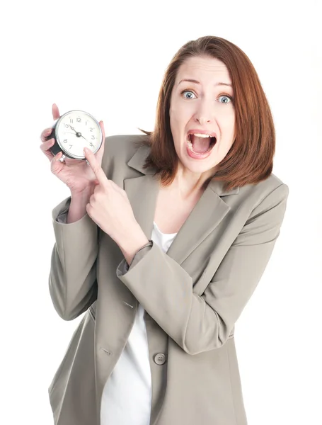 Femme d'affaires drôle avec une horloge choquante isolé sur blanc — Photo