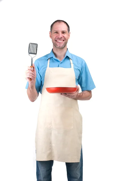 Handsome man holding a dish for your — Stock Photo, Image