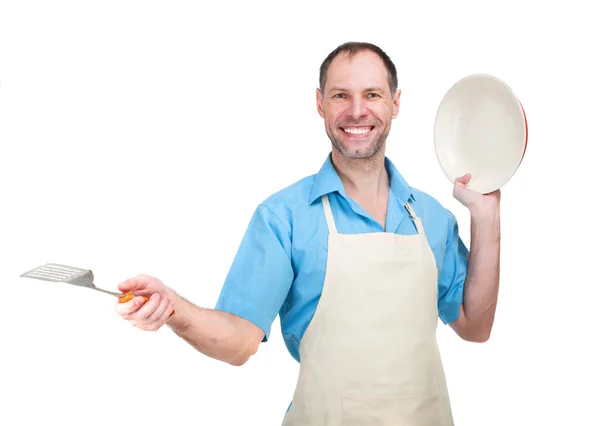 Handsome man holding a dish for your Stock Picture