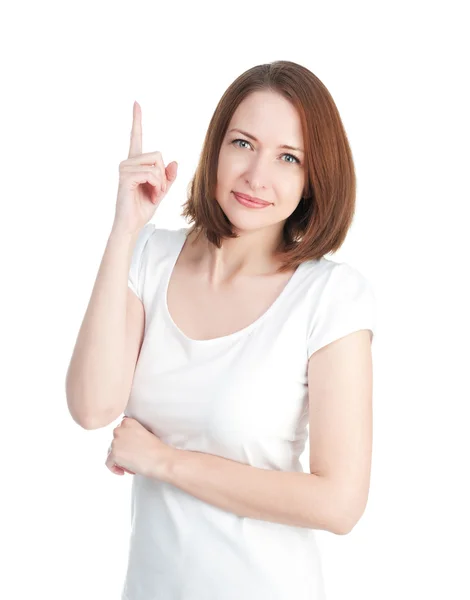 Dívka v bílém tričku ukazuje palcem izolovaných na bílém backgro — Stock fotografie