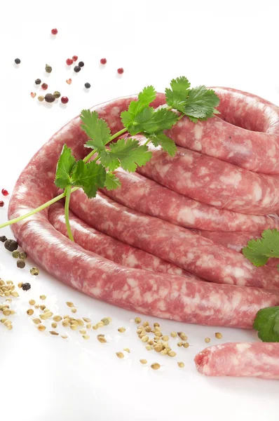 A natural raw sausage on white — Stock Photo, Image