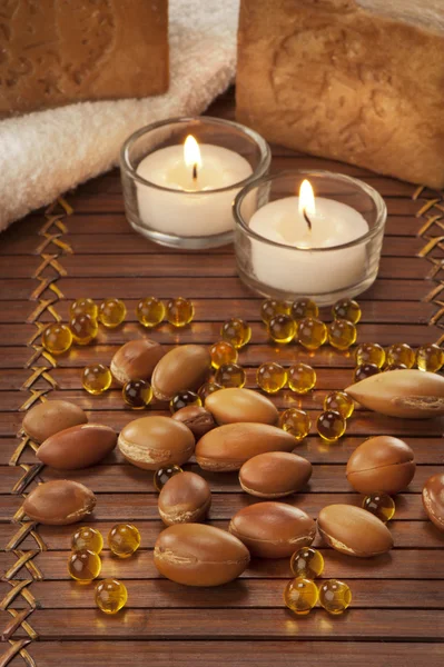 Seeds of argan with light and soap — Stock Photo, Image