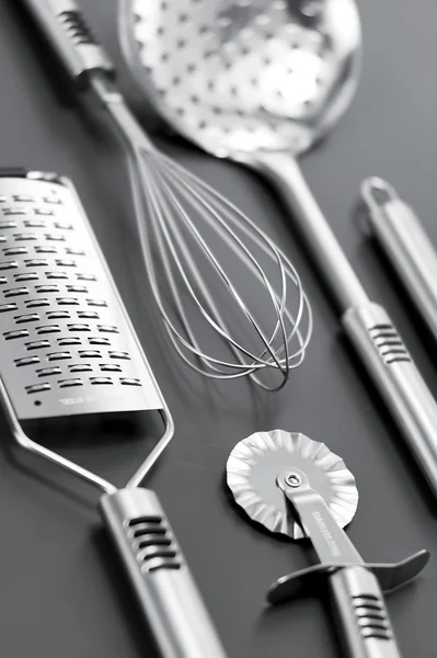 Steinless kitchen stuff on gray background — Stock Photo, Image