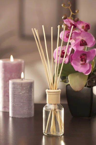 Air freshener sticks at home with flowers and ou of focus backgr — Stock Photo, Image