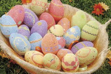 Easter eggs hidden in natural straw nest
