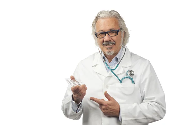 Caucasian mature male doctor on bright background — Stock Photo, Image