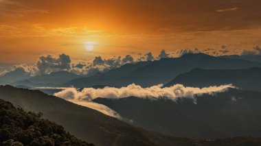 Sunrise over the mountains of the Sierra Nevada de Santa Marta on the way to Lost City clipart