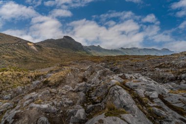 The majestic black lagoon in the snowy park where the Nevado del Ruiz, Nevado del Tolima and the Nevado Santa Isabel are located