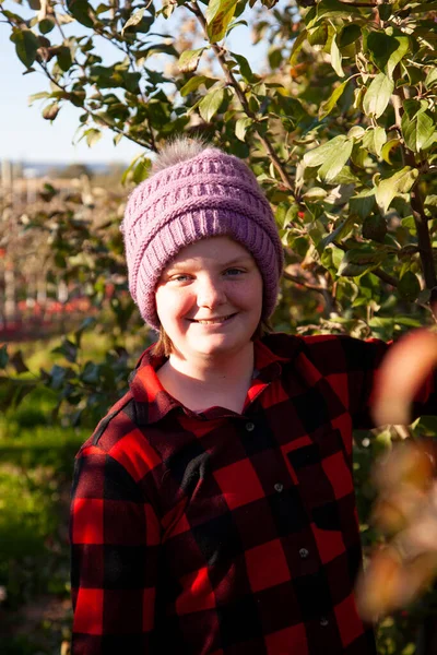 Young Child Wearing Red Black Plaid Cap Smiles Apple Orchard — Foto de Stock