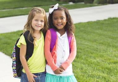 Cute little girls walking to school together clipart