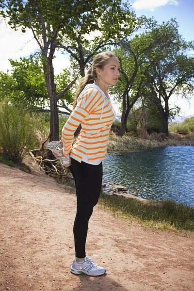 Female Runner Stretching outdoors — Stock Photo, Image