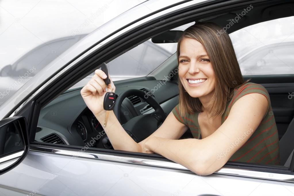 Happy woman renting or buying a car