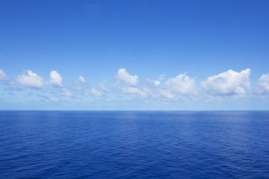 Calm vibrant blue ocean clipart