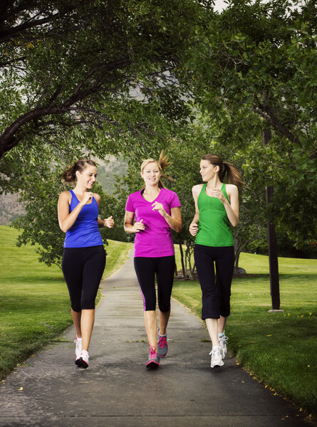 Beautiful Women Jogging Together outdoors