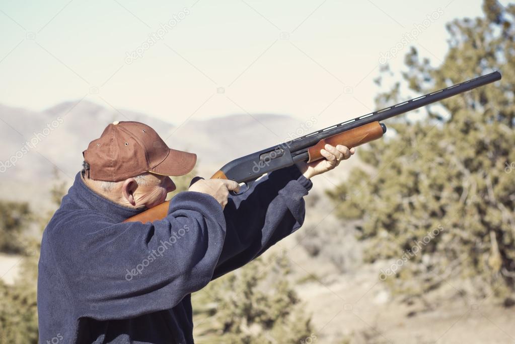 Man Shooting a Shotgun Hunting