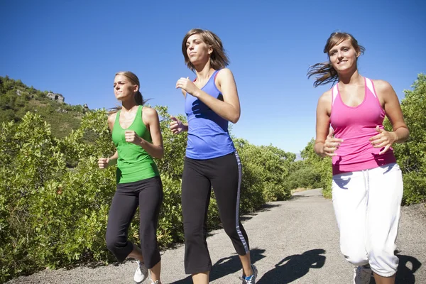 Jogging kobiece kobieta działa — Zdjęcie stockowe