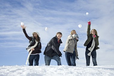 Young adults snowball fighting clipart
