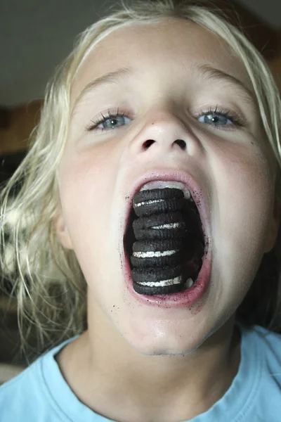 Taking an Giant Bite of cookies — Stock Photo, Image