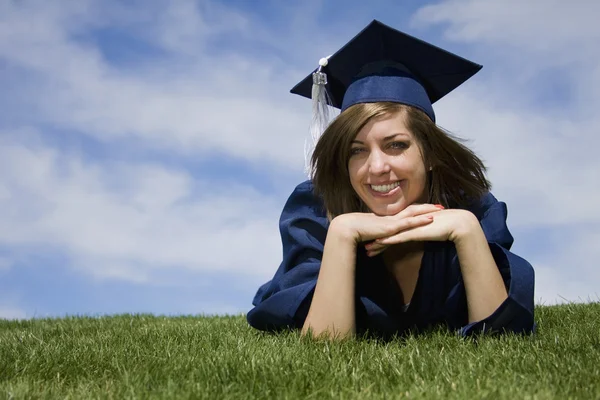Graduate with her cap and gown — Stock Photo, Image