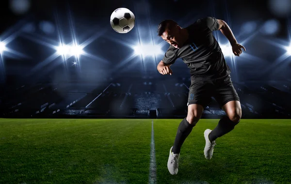 Hispanic Soccer Player heading the ball — Stock Photo, Image