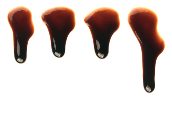 Chocolate syrup drops leaking — Stock Photo, Image